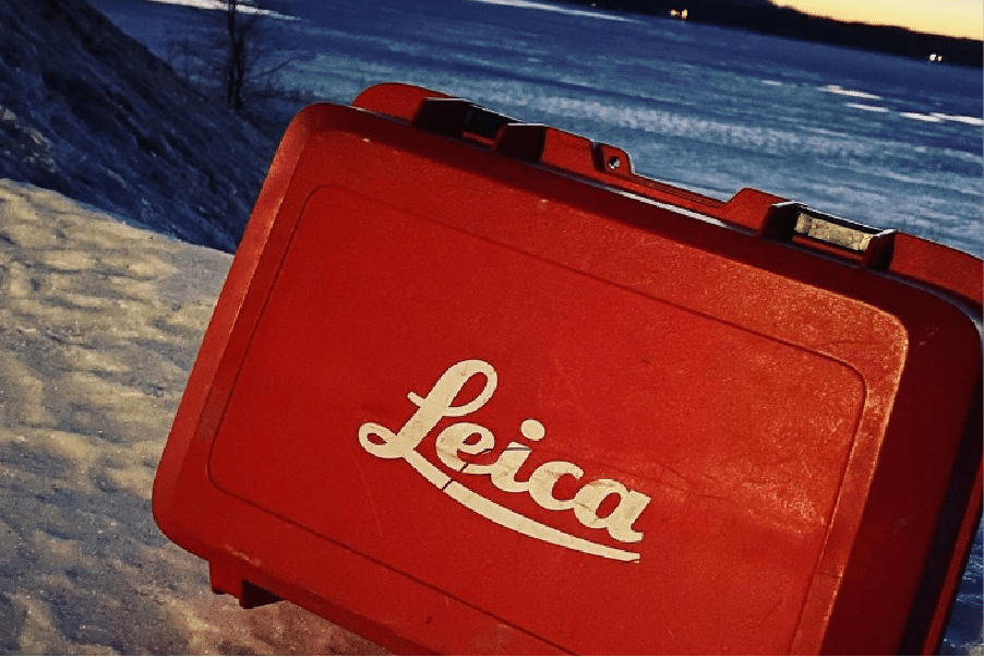 leica survey case on some snow on a lake in northern british columbia