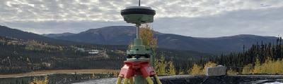 construction and mining surveyor in whitehorse performing a topographic survey near keno