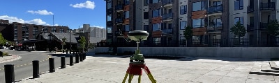 One of our Geomatics surveyors doing a survey downtown in Prince George